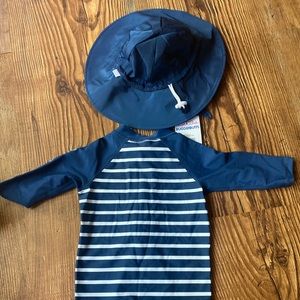 Never worn- tags on hat not on rashguard suit